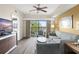 Spacious living room with balcony access and hardwood floors at 12538 Floridays Resort Dr # 411, Orlando, FL 32821