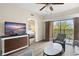 Bright living room, featuring hardwood floors and a view of the bedroom at 12538 Floridays Resort Dr # 411, Orlando, FL 32821