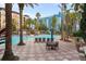 Resort-style pool with lounge chairs and umbrellas at 12538 Floridays Resort Dr # 411, Orlando, FL 32821