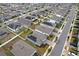 Aerial view of a residential neighborhood with solar panels at 1280 Tupelo Trl, Haines City, FL 33844