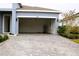 Empty garage with white walls and open garage door at 1280 Tupelo Trl, Haines City, FL 33844