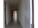 Bright hallway with tile flooring leading to the living room at 1280 Tupelo Trl, Haines City, FL 33844