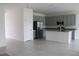 Modern kitchen with gray cabinets, granite countertops, and stainless steel appliances at 1280 Tupelo Trl, Haines City, FL 33844
