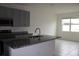 Kitchen with granite island and stainless steel appliances at 1280 Tupelo Trl, Haines City, FL 33844