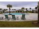 Community pool with lounge chairs and a shaded area at 1280 Tupelo Trl, Haines City, FL 33844