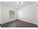 Bedroom with large window and laminate flooring at 13380 Sw 60Th Court Rd, Ocala, FL 34473