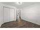 Bright bedroom with double doors and laminate flooring at 13380 Sw 60Th Court Rd, Ocala, FL 34473