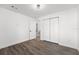 Well-lit bedroom with double door closet and access to a bathroom at 13380 Sw 60Th Court Rd, Ocala, FL 34473