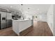 Modern kitchen with gray cabinets, quartz countertops, and stainless steel appliances at 13380 Sw 60Th Court Rd, Ocala, FL 34473