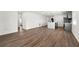 Open concept kitchen and living area with modern island and grey cabinets at 13380 Sw 60Th Court Rd, Ocala, FL 34473