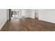 Spacious living room with wood-look flooring and sliding glass doors at 13380 Sw 60Th Court Rd, Ocala, FL 34473