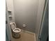 Small bathroom featuring toilet and open shelves at 143 Glasgow Ct, Davenport, FL 33897