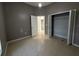 This bedroom features a bi-fold closet and neutral tones at 143 Glasgow Ct, Davenport, FL 33897