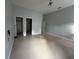 Bedroom featuring doors and tile floors at 143 Glasgow Ct, Davenport, FL 33897