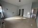 Bedroom featuring a light, and doors at 143 Glasgow Ct, Davenport, FL 33897
