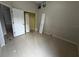 This bedroom features tile floors, an open closet, and neutral paint at 143 Glasgow Ct, Davenport, FL 33897