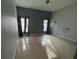 Bedroom with two windows and tile floors at 143 Glasgow Ct, Davenport, FL 33897