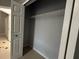 This closet features a bi-fold door and chrome shelving at 143 Glasgow Ct, Davenport, FL 33897