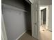 Bedroom closet with ample storage space, wire shelving, and white doors at 143 Glasgow Ct, Davenport, FL 33897
