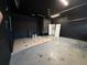 Spacious garage area with unfinished flooring and a large open space, ready for customization at 143 Glasgow Ct, Davenport, FL 33897