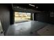 Open garage showcasing neighborhood view, providing a glimpse of the home's surroundings at 143 Glasgow Ct, Davenport, FL 33897