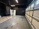 Large garage with access doors, offering plenty of space for storage and vehicle parking at 143 Glasgow Ct, Davenport, FL 33897