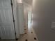 Hallway with tile floors and visible doorways at 143 Glasgow Ct, Davenport, FL 33897