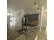 Well lit kitchen with granite countertops, stainless steel refrigerator, and tile flooring at 143 Glasgow Ct, Davenport, FL 33897