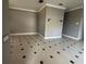Neutral living room showing tile floors, neutral walls, decorative trim, and a light switch at 143 Glasgow Ct, Davenport, FL 33897