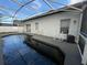 Backyard pool area with seating, offering a great spot for outdoor lounging and entertainment at 143 Glasgow Ct, Davenport, FL 33897