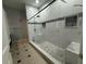 Spacious walk-in shower featuring a bench, shower head, and tile surround at 143 Glasgow Ct, Davenport, FL 33897