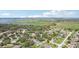 Aerial view showing houses, lakes, and wetland areas of the neighborhood in a picturesque setting at 1534 Gants Cir, Kissimmee, FL 34744