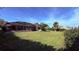 Large, well-maintained backyard featuring a screened-in patio and ample green space at 1534 Gants Cir, Kissimmee, FL 34744