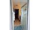Bathroom hallway with view of the shower stall and vanity at 1534 Gants Cir, Kissimmee, FL 34744