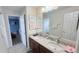 Bathroom with dual sink granite vanity, tile floors and framed mirror at 1534 Gants Cir, Kissimmee, FL 34744