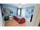 This bedroom is decorated with race car themed decor and a car shaped bed at 1534 Gants Cir, Kissimmee, FL 34744