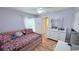 Bedroom with light purple walls, a pink day bed and white furniture at 1534 Gants Cir, Kissimmee, FL 34744