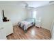 Cozy bedroom with light flooring and a ceiling fan at 1534 Gants Cir, Kissimmee, FL 34744
