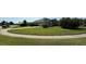 Well-maintained home featuring a neatly manicured front lawn and mature landscaping, offering curb appeal at 1534 Gants Cir, Kissimmee, FL 34744