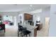 Well-lit kitchen with a breakfast bar, tile floors, and an open layout leading to the lanai at 1534 Gants Cir, Kissimmee, FL 34744