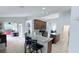 Open kitchen with granite counters and access to patio at 1534 Gants Cir, Kissimmee, FL 34744
