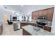 Modern kitchen with granite countertops and island at 1534 Gants Cir, Kissimmee, FL 34744