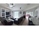 Living room boasts an entertainment center and an open view to the lanai with a pool at 1534 Gants Cir, Kissimmee, FL 34744