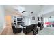 Comfortable living room with modern entertainment center and easy access to the outdoor living area at 1534 Gants Cir, Kissimmee, FL 34744