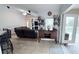 Living room with tiled floors, entertainment center, and a bar cabinet perfect for hosting guests at 1534 Gants Cir, Kissimmee, FL 34744