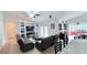 Bright living room with comfortable seating, entertainment center, and an open sunroom view at 1534 Gants Cir, Kissimmee, FL 34744