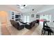 Spacious living room with pool view, fireplace, and comfortable seating at 1534 Gants Cir, Kissimmee, FL 34744