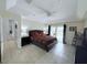 Spacious main bedroom with tile floors, ceiling fan and ensuite at 1534 Gants Cir, Kissimmee, FL 34744