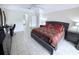 Spacious main bedroom with tile floors, ceiling fan and view to ensuite at 1534 Gants Cir, Kissimmee, FL 34744