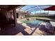 Beautiful screened-in pool and spa with covered patio, ideal for relaxation and enjoying the outdoors at 1534 Gants Cir, Kissimmee, FL 34744